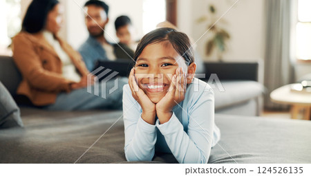 Family, love and smile and portrait of child on sofa for calm, care and comfortable. Support, happiness and connection with young girl in living room of home for commitment, relax and growth 124526135
