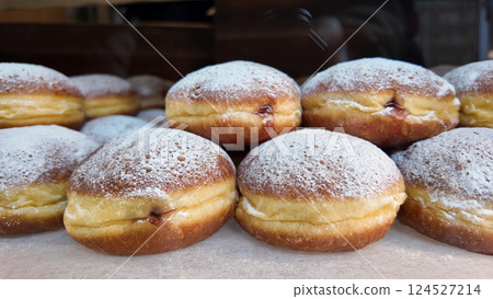 Delicious filled pastries displayed in a bakery window 124527214