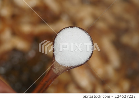 Salt being added to enhance flavors in a cooking process Salt being added to enhance flavors in a cooking process 124527222