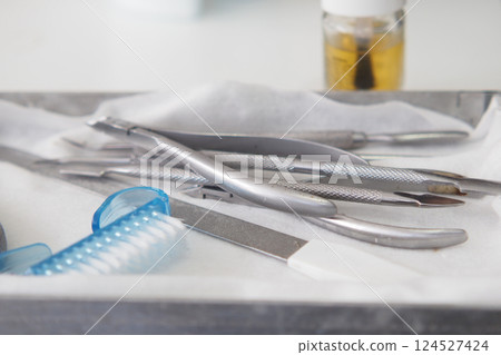 Surgical instruments arranged on a tray in a medical setting Surgical instruments arranged on a tray in a medical setting 124527424