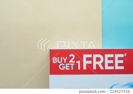 Promotion for buying two items and getting one for free Promotion for buying two items and getting one for free 124527538