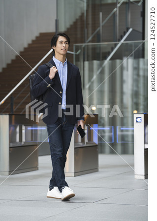 Young businessman commuting to work and leaving work image 124527710