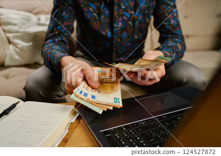 Man Counting Euro Banknotes, Financial Planning with Cash Money Man Counting Euro Banknotes, Financial Planning with Cash Money 124527872