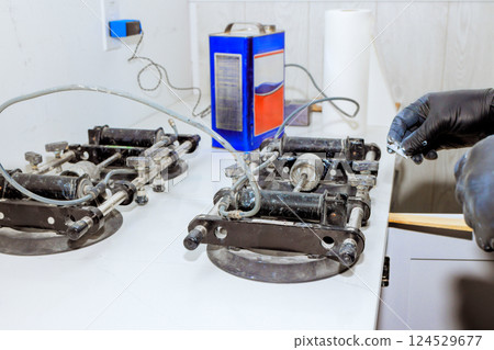 Technician applies to help you consistently produce virtually invisible seams, Stealth Seamer installs seamless countertop joints, levels, stone Technician applies to help you consistently produce virtually invisible seams, Stealth Seamer installs seamless countertop joints, levels, stone 124529677