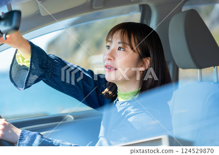 A woman driving a car A woman driving a car 124529870