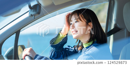 A woman driving a car A woman driving a car 124529873