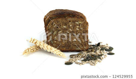 Slices of whole wheat seed bread presented with wheat and a mix of seeds, on white. Slices of whole wheat seed bread presented with wheat and a mix of seeds, on white. 124529955