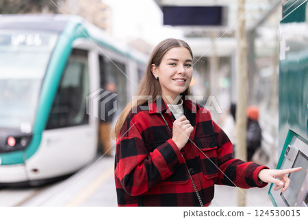 girl pays for a tram fare girl pays for a tram fare 124530015