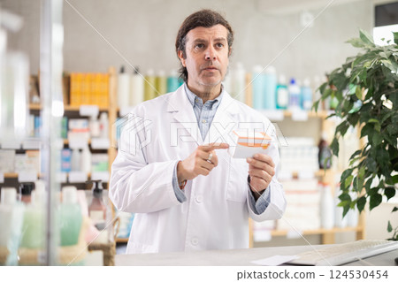 Man pharmacist offers antiallergic pills Man pharmacist offers antiallergic pills 124530454