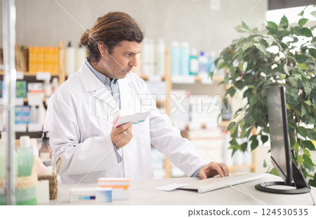 Man pharmacist offers antiallergic pills Man pharmacist offers antiallergic pills 124530535
