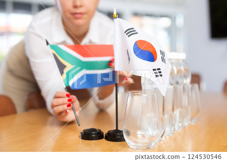 National flags of South Africa and Republic of Korea on negotiating table 124530546