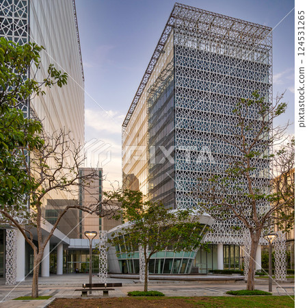 Modern architecture of Menara Tulus in Putrajaya highlighted by geometric designs in a lush park setting Modern architecture of Menara Tulus in Putrajaya highlighted by geometric designs in a lush park setting 124531265