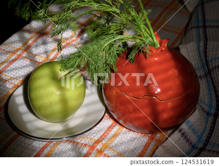 Still life with a red jug, dill and a green apple 124531619