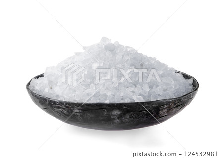 Sea salt in a decorative bowl on a neutral background for culinary use or decoration 124532981