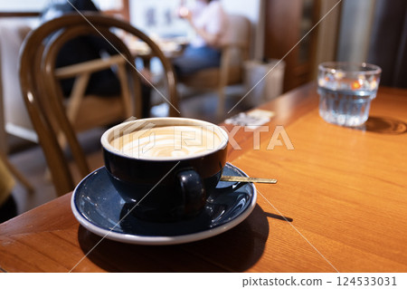 Coffee with latta art on the table 124533031