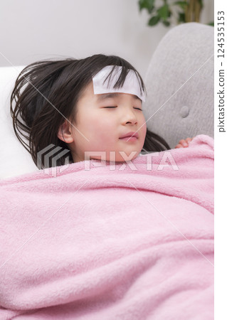 A girl with a fever and nursing her A girl with a fever and nursing her 124535153