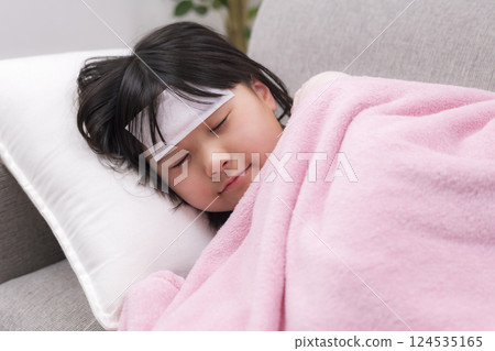 A girl resting with a cooling sheet A girl resting with a cooling sheet 124535165