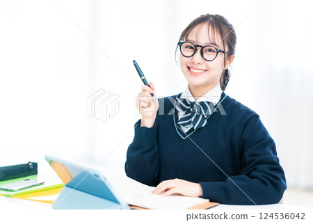 High school students taking online classes posing with pens High school students taking online classes posing with pens 124536042