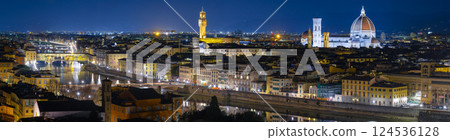Night panoramic view of Florence. Cathedral Santa Maria Del Fiore, Arnolfo tower, Ponte Vecchio bridge. Masterpieces of medieval ages glowing in the night. Florence, Italy - 11 Jan 2022 124536128