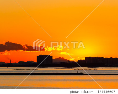 A beautiful sunset over the city seen from Funabashi Port across Tokyo Bay A beautiful sunset over the city seen from Funabashi Port across Tokyo Bay 124536607