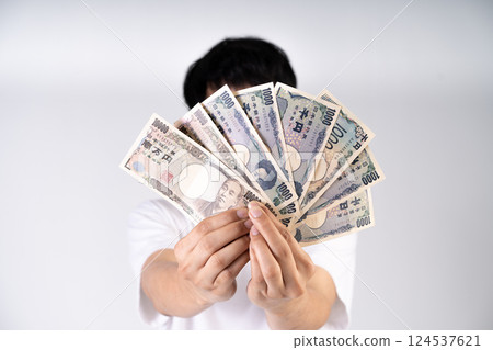 Japanese Yen notes fanned out illustrate global monetary transactions and international trade dynamics 124537621