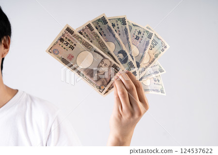 Japanese Yen notes fanned out illustrate global monetary transactions and international trade dynamics 124537622