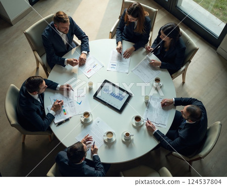 Business meeting collaboration with digital technology and data analysis in modern office 124537804