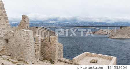 Island of Pag old desert ruins and bridge panorama view, Dalmatia, Croatia. Island of Pag old desert ruins and bridge panorama view, Dalmatia, Croatia. 124538604