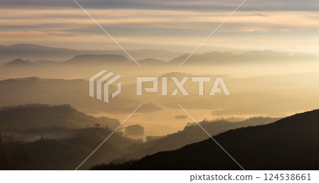 View from Adam's peak, Sri Lanka. Valley view with lakes and mountains at sunrise. View from Adam's peak, Sri Lanka. Valley view with lakes and mountains at sunrise. 124538661
