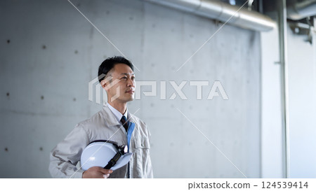 Male worker inspecting equipment Male worker inspecting equipment 124539414