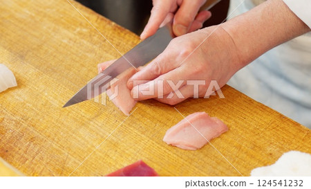 A Japanese chef cutting swordfish 124541232