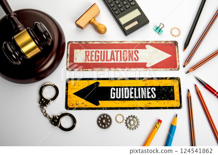 Regulations and Guidelines. Red and yellow directional arrow with text 124541862