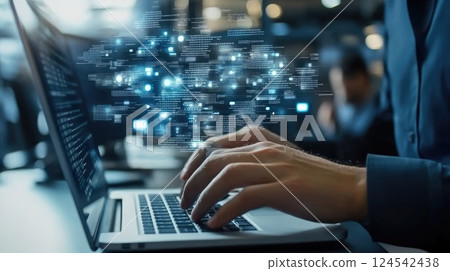 Young male tech worker engages with laptop in a data center, collaborating on cloud computing while others work nearby at night 124542438