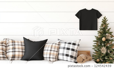 A close-up of a black t-shirt hanging in a warm log cabin living area, surrounded by wooden furniture and a welcoming atmosphere 124542439
