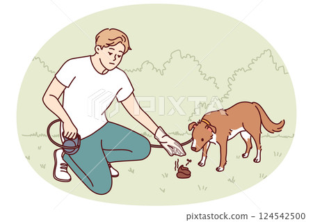 Man walking dog puts excrement own puppy in plastic bag so as not to pollute park. 124542500