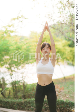 Female jogger. Fit young Asian woman with sportswear stretching muscle in park before running and enjoying healthy outdoor. Fitness runner girl in public park. Wellness being concept Female jogger. Fit young Asian woman with sportswear stretching muscle in park before running and enjoying healthy outdoor. Fitness runner girl in public park. Wellness being concept 124542646