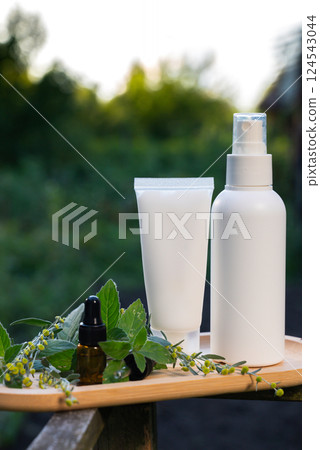 White handmade cosmetic bottles template mockup skin care herbal alternative Insect repellent outdoors during summer. Trying to kill mosquitoes and flies with organic ingredients mint extract oil 124543044