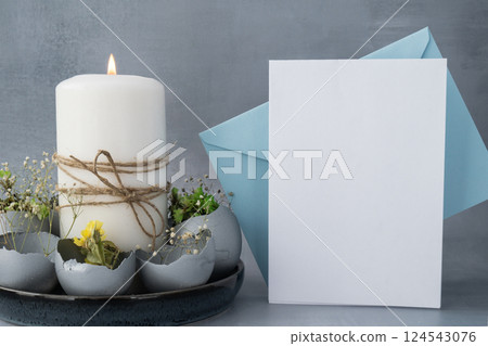 Envelope mockup template Self made egg shell with candle handmade decoration for Easter holiday. Copy space greeting card present gift ideas. Creative reuse zero waste sustainable living eco-friendly 124543076