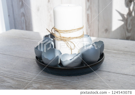 Female hands making egg shell handmade decoration for Easter holiday. Tutorial master class storytelling. Zero waste sustainable eco-friendly me made decor. Minimalistic 124543078