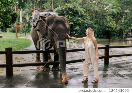 beautiful girl with smiling elephant, elephant village, bali 124543093