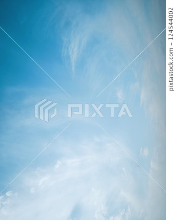 sky is blue and clear with no clouds. The sky is very bright and the sun is shining 124544002