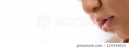 Close-up of toddler lips and nose in soft light, showing detail of face and gentle skin 124544033