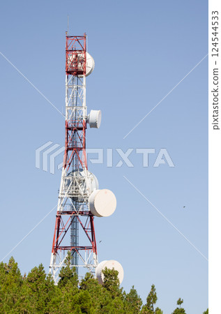 Atenna for telecommunications over a forest. Atenna for telecommunications over a forest. 124544533