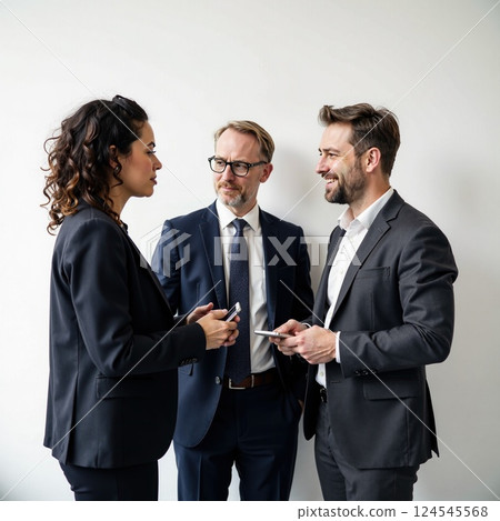 Diverse professionals engaged in discussion against white background 124545568