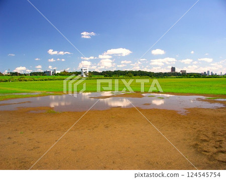 A baseball field with puddles on the Edogawa riverbed after an autumn rain A baseball field with puddles on the Edogawa riverbed after an autumn rain 124545754
