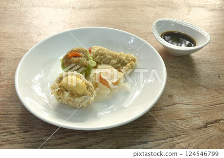 steamed Chinese dumpling Ha Kao stuffing shrimp and cheese with salty egg on plate dipping soy sauce steamed Chinese dumpling Ha Kao stuffing shrimp and cheese with salty egg on plate dipping soy sauce 124546799