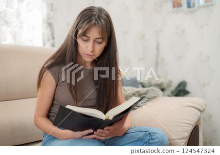 Bible, woman 20s study and writing, notes on religion at desk in home, Christian faith and knowledge of God. Reading, hope and girl holy book, learning gospel inspiration prayer 124547324