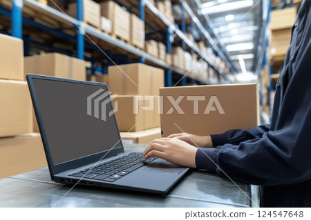 Minimalistic Business Workspace with Laptop in Modern Commerce Warehouse Environment 124547648