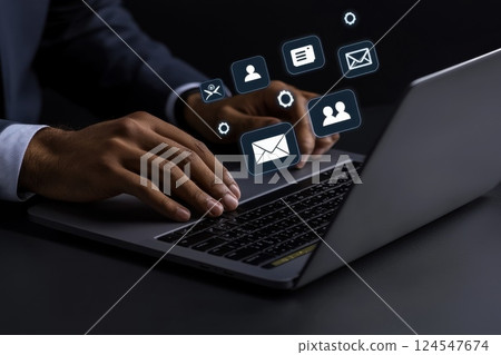 Businessperson in Motion Creating Dynamic Digital Effects over Laptop with Motion Blur 124547674