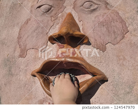 Mouth of truth in Bussana Vecchia artist retreat medieval village destroyed by earthquake in 1887 124547970
